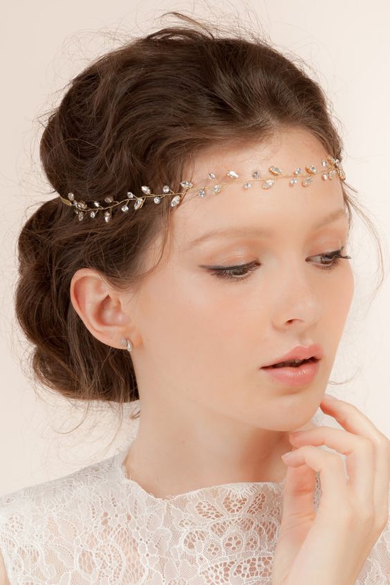 Wedding hairstyles with a tiara falling on the forehead