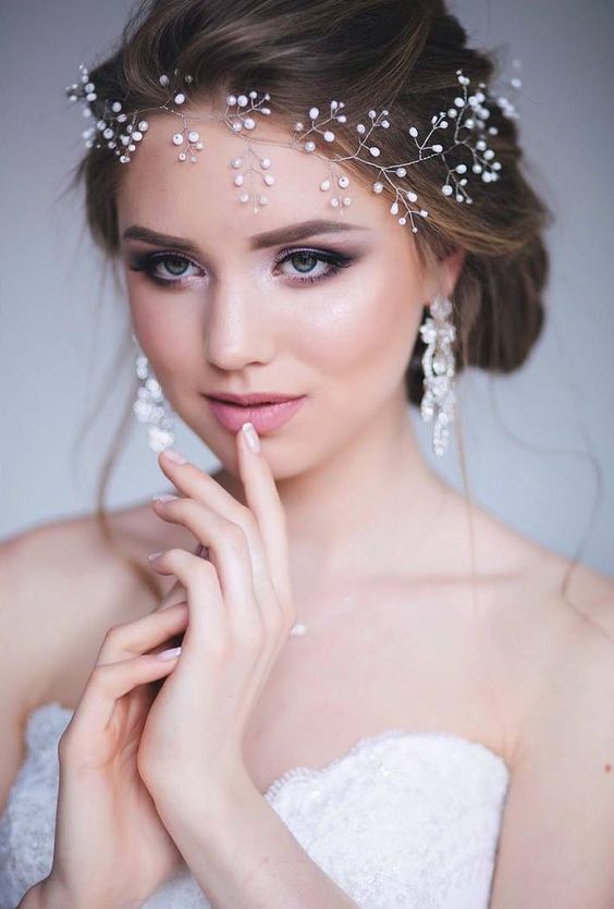 Wedding hairstyles with a tiara falling on the forehead