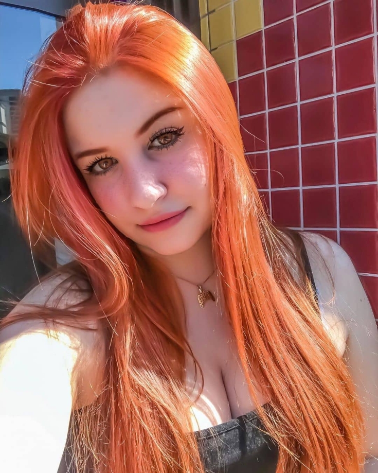 Red hair color with brown eyes